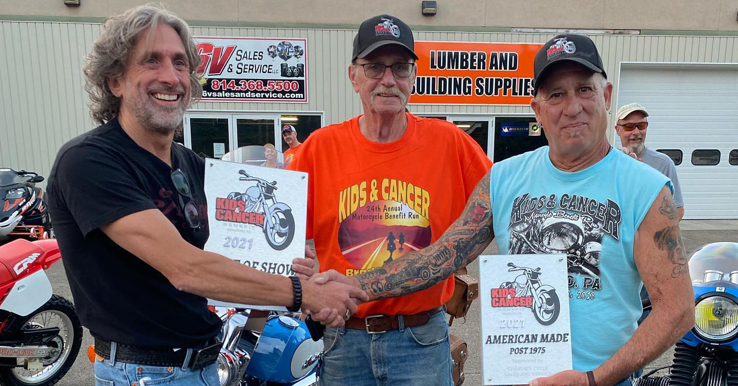 Kids and Cancer President Bill Black with winners of the Kids and Cancer bike show, part of Kids and Cancer's annual benefit run, which raises funds for the grants distributed by Kids and Cancer throughout the year.